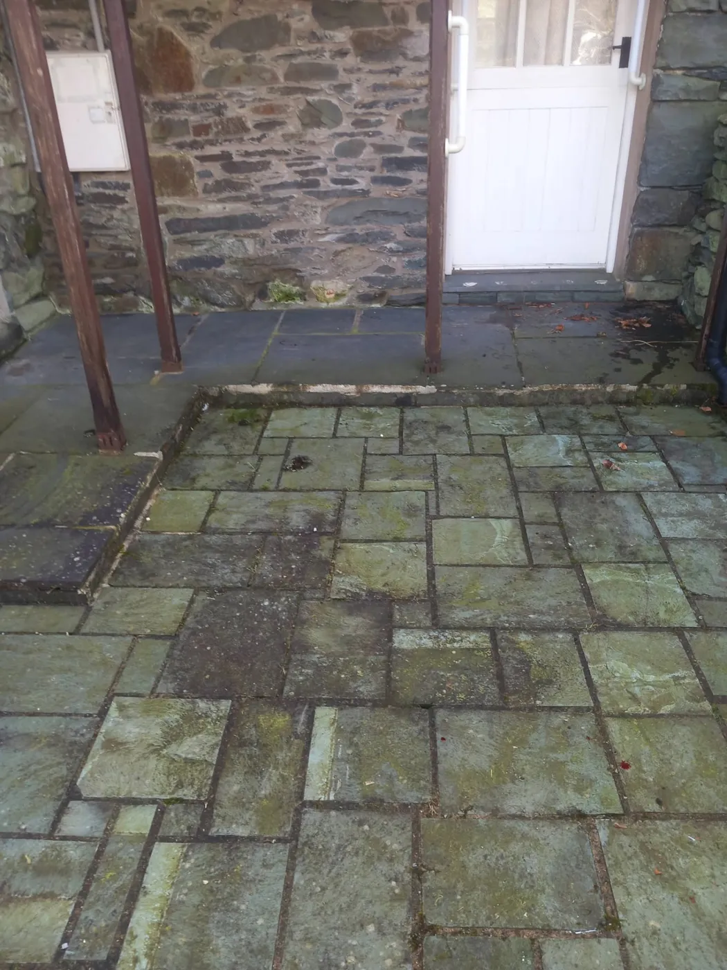 Slate flags at a cottage doorway — before and after cleaning — before
